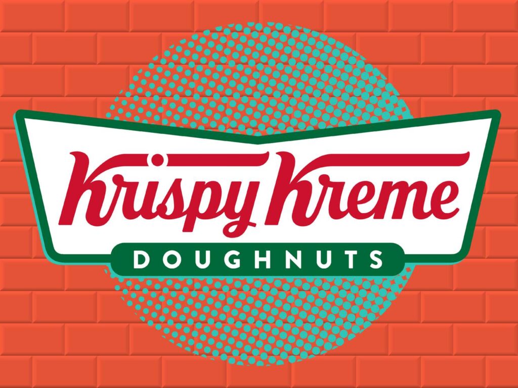 Krispy Kreme logo on a white banner with red cursive text, green border, teal dotted circle, against a red brick wall background.